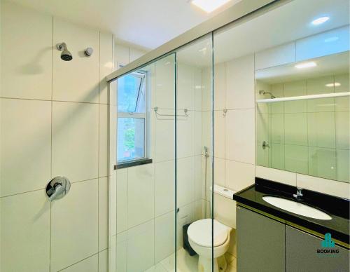 a bathroom with a shower and a toilet and a sink at Aquarius Style by Holiday Stays in Fortaleza