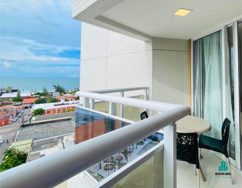 a balcony with a table and a view of the ocean at Aquarius Style by Holiday Stays in Fortaleza