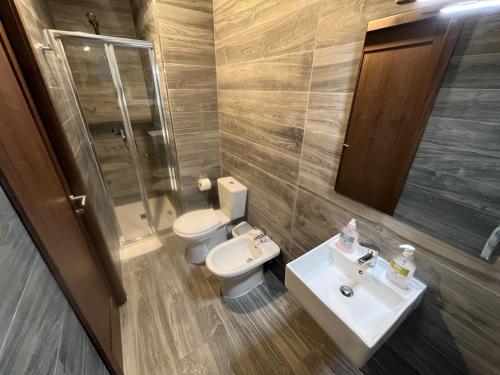 a bathroom with a toilet and a sink at The Old Mint Residence 4 in Valletta