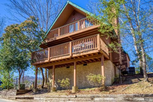 a house with a balcony on the side of it at BlackBerry Ridge in Pigeon Forge