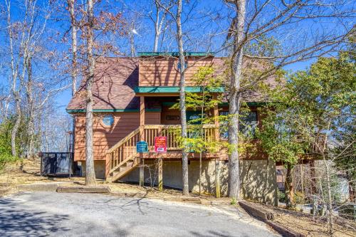 a house with a wrap around porch and a deck at BlackBerry Ridge in Pigeon Forge