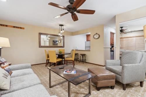 a living room with a couch and a table at Eagle Point Resort in Vail