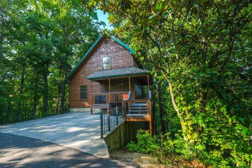 a small cabin in the middle of a forest at Grandpas Getaway in Pigeon Forge