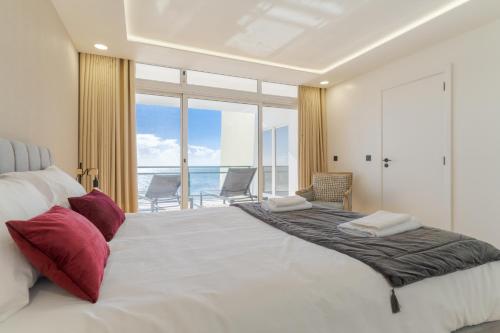 Ένα ή περισσότερα κρεβάτια σε δωμάτιο στο Hip Heaven Apartment on Beach