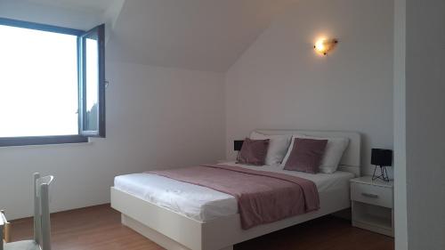 Postel nebo postele na pokoji v ubytování Gabrijela