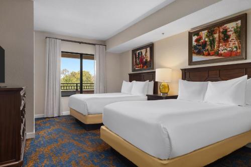 Ένα ή περισσότερα κρεβάτια σε δωμάτιο στο Club Wyndham Bonnet Creek