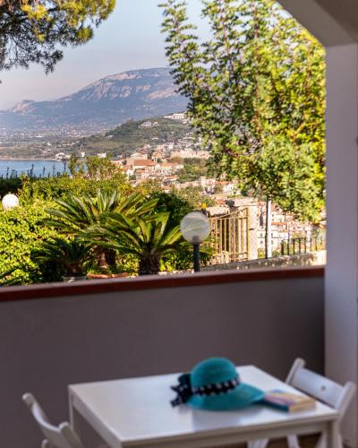 a room with a table and a view of a city at B&B Belvedere in Agropoli