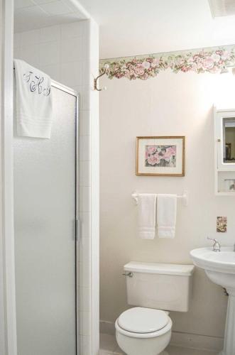 a bathroom with a toilet and a sink at Headlands Inn Bed and Breakfast in Mendocino