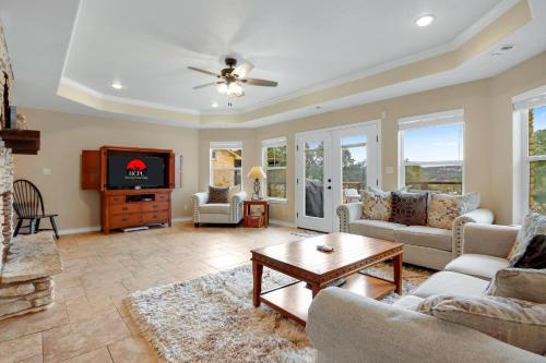 a living room with a couch and a tv at Something Special Too in Canyon Lake
