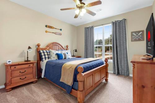 a bedroom with a bed and a ceiling fan at Something Special Too in Canyon Lake