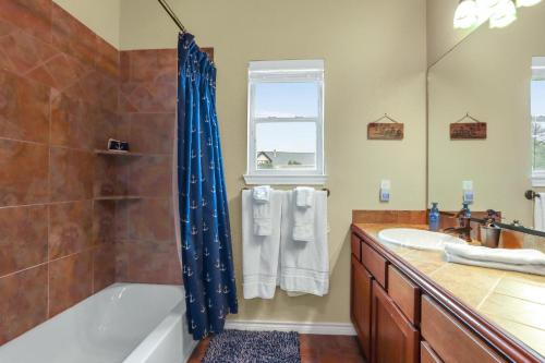 a bathroom with a tub and a sink at Something Special Too in Canyon Lake