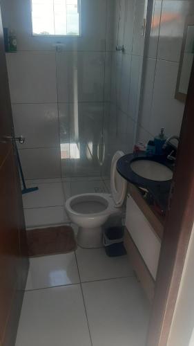 a bathroom with a shower and a toilet and a sink at Ap do montinegro in Campina Grande