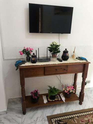 TV a/nebo společenská místnost v ubytování Aconchego da Jô