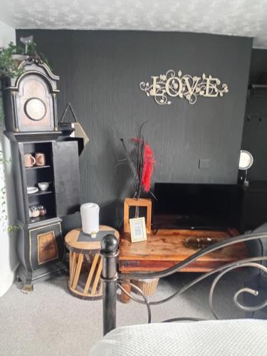 a room with a wooden table and a stove at The Ocean Guest House in Weymouth