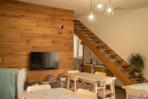 a living room with a table and a television at La Campagna di Peppe e Tullia in Formia