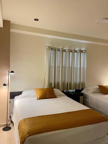 Letto o letti in una camera di Hotel Villa Serena San Benito