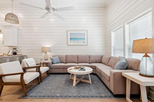 a living room with a couch and a table at Brand New Luxury Rental on Oleander Unit A in Dauphin Island