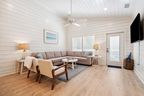 a living room with a couch and a table at Brand New Luxury Rental on Oleander Unit A in Dauphin Island