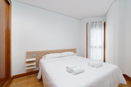 Postel nebo postele na pokoji v ubytování Sencillo apartamento en el corazón de Vigo by CABANA Rentals