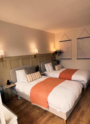 two beds in a hotel room with two at The Tower House B&B in Thomastown