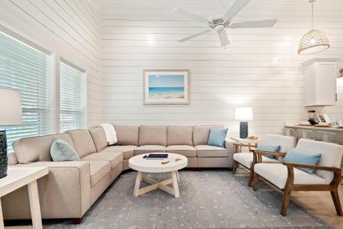 a living room with a couch and a table at Brand New Luxury Rental on Oleander Unit C in Dauphin Island