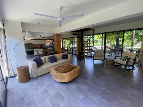 a living room with a couch and a table at CASA NiCO in Río Sequito