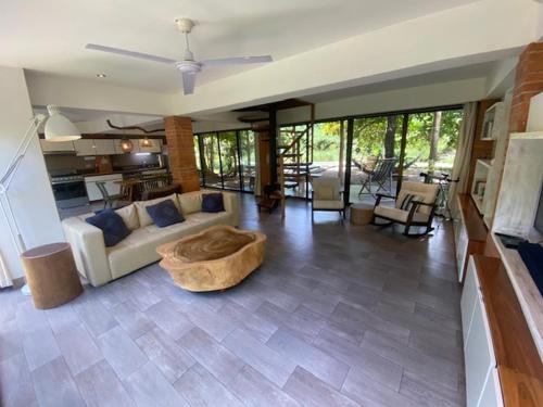 a living room with a couch and a table at CASA NiCO in Río Sequito