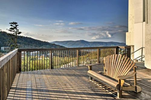 a wooden chair sitting on a deck with a view at Pool Access! Ski-InandOut Sugar Mtn Gem with Views in Sugar Mountain