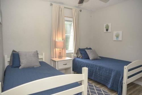 a bedroom with two beds and a window at Townhomes near the Bay - #4 in Grand Bay