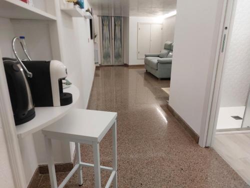 a room with a white table and a chair at Casa Caratino in Mattinata