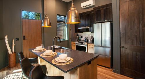 a kitchen with a island with dishes on it at The Njörd in Duluth