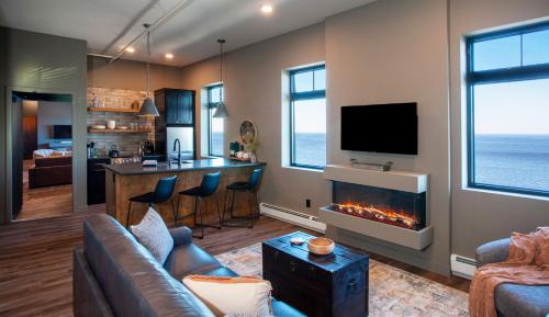 a living room with a couch and a fireplace at The Njörd in Duluth