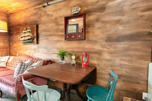 a living room with a table and a couch at Breakwater Resort in Grayland