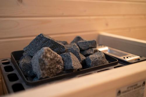 a tray of rocks sitting on top of a stove at Riserva Bianca Limone Hotel & SPA in Limone Piemonte