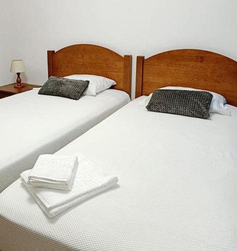 Ένα ή περισσότερα κρεβάτια σε δωμάτιο στο Ocean Front TWIN Rooms