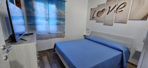 Ένα ή περισσότερα κρεβάτια σε δωμάτιο στο Casa Vacanze Moro