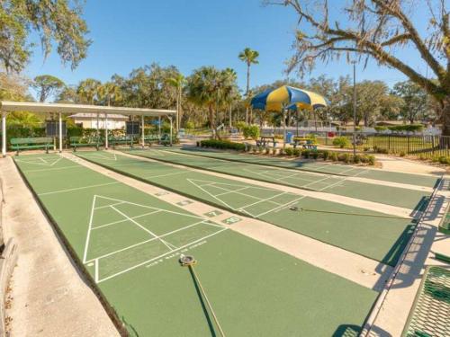 a tennis court with two tennis courts at Serenity Cabin in Dover