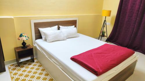 Postel nebo postele na pokoji v ubytování Bliss Homestay