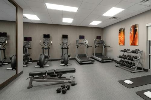 a gym with several exercise equipment in a room at Courtyard by Marriott Gatlinburg Downtown in Gatlinburg