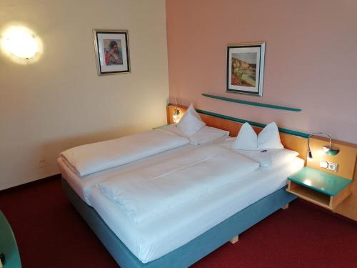 Postel nebo postele na pokoji v ubytování Hotel Marko
