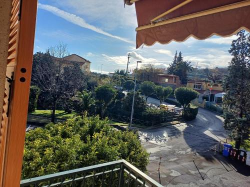 a view of a street from a balcony of a house at Brezza Marina in Pietra Ligure
