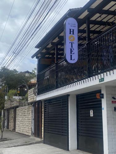 a building with a purple sign on the side of it at Air Suites Hotel Boutique in Quito