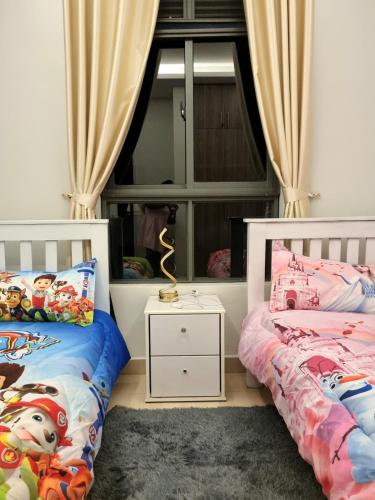 two beds in a room with a window at BLT at Pearl Marina Estate Garuga in Entebbe