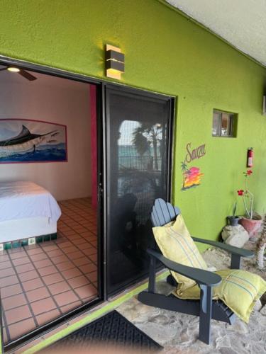 a room with a room with a bed and a chair at Agave Hotel Club in Buenavista