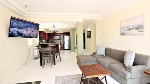 a living room with a couch and a table at Tijuana Beach View & Patio in Tijuana