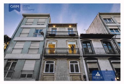 a group of tall buildings in a city at ORM - Almada Apartments in Porto