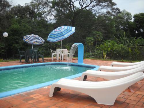 Bazén v ubytování Pousada Chácara Mamma Gaia nebo v jeho okolí