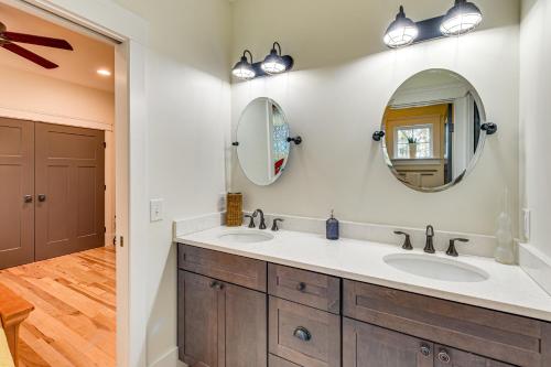 a bathroom with two sinks and a mirror at Fire Pit and Patio Spacious Southern Pines Retreat in Southern Pines