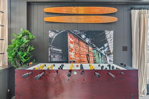 two surfboards on top of a table with a surfboard at Luxury Designer Home Theatre Games & BBQ Grill in Millard
