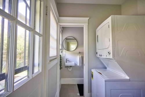 a small bathroom with a sink and a mirror at The Local House in Raleigh